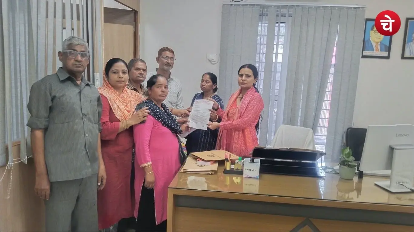 Office bearers of a women committee and local women holding a meeting regarding the water crisis in Noida slum settlements